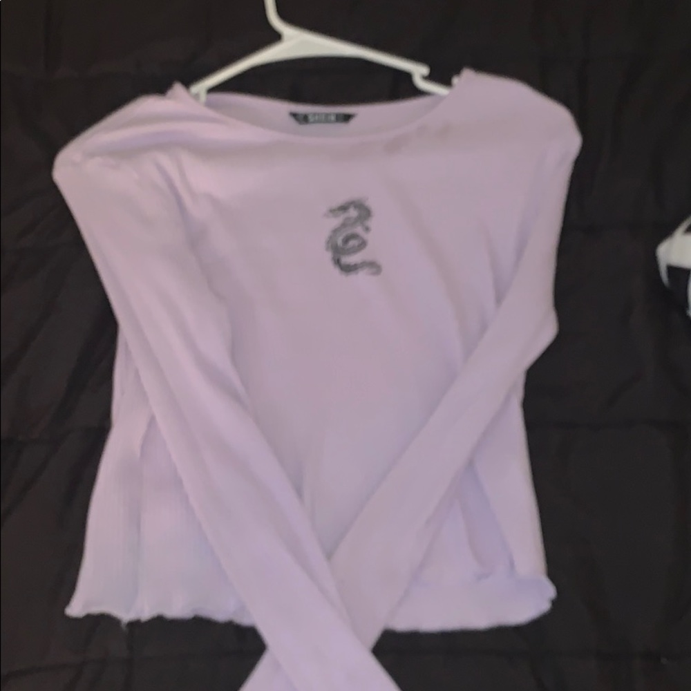 a long sleeve purple shirt.